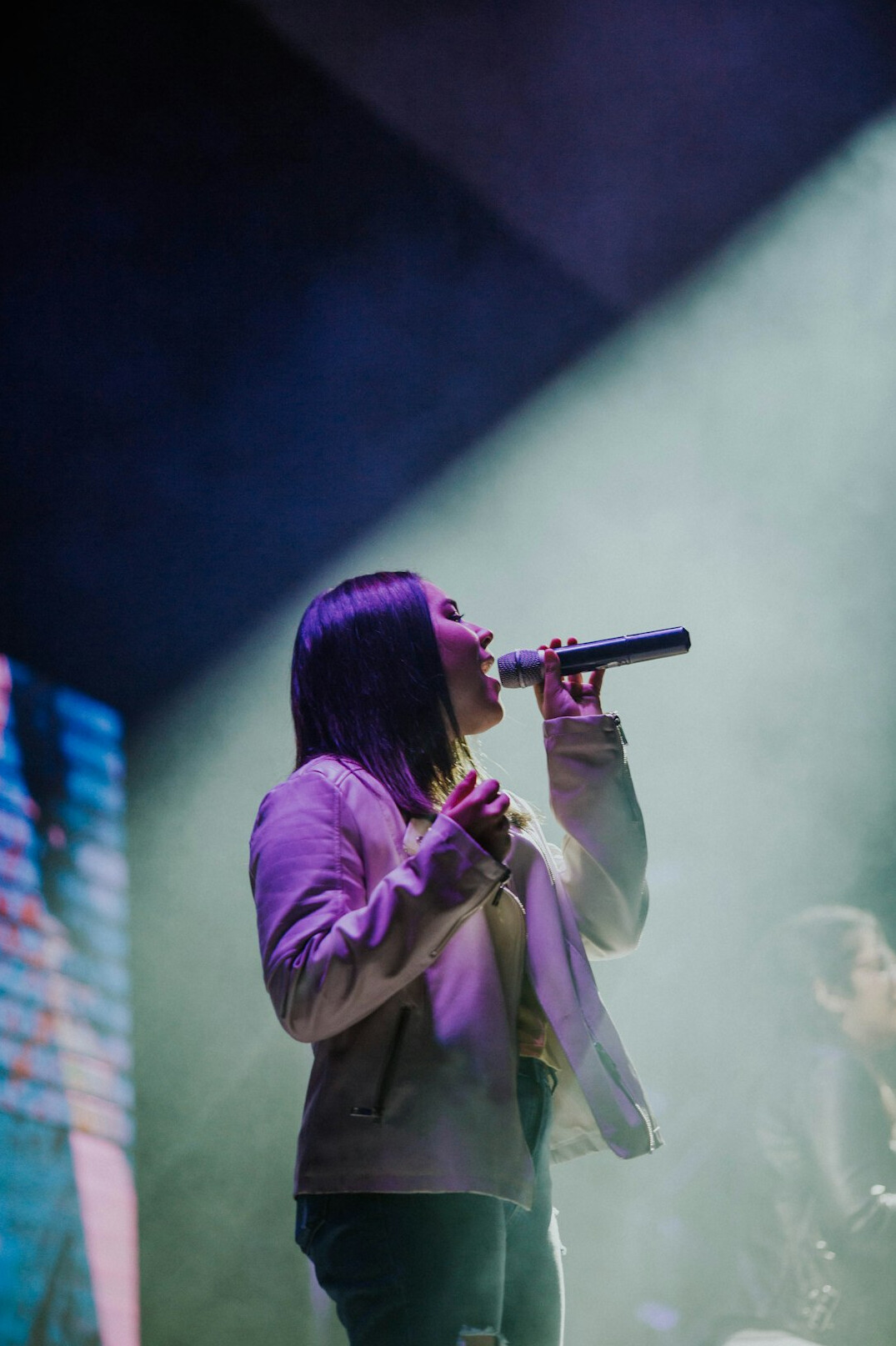 young woman singer on stage