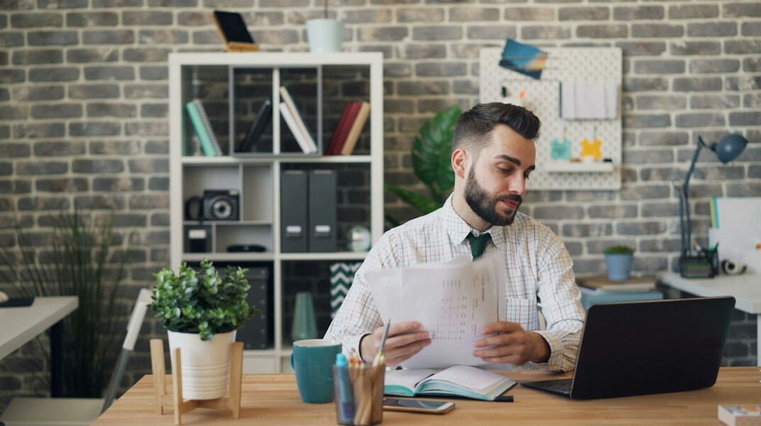 businessman reviewing documents in office