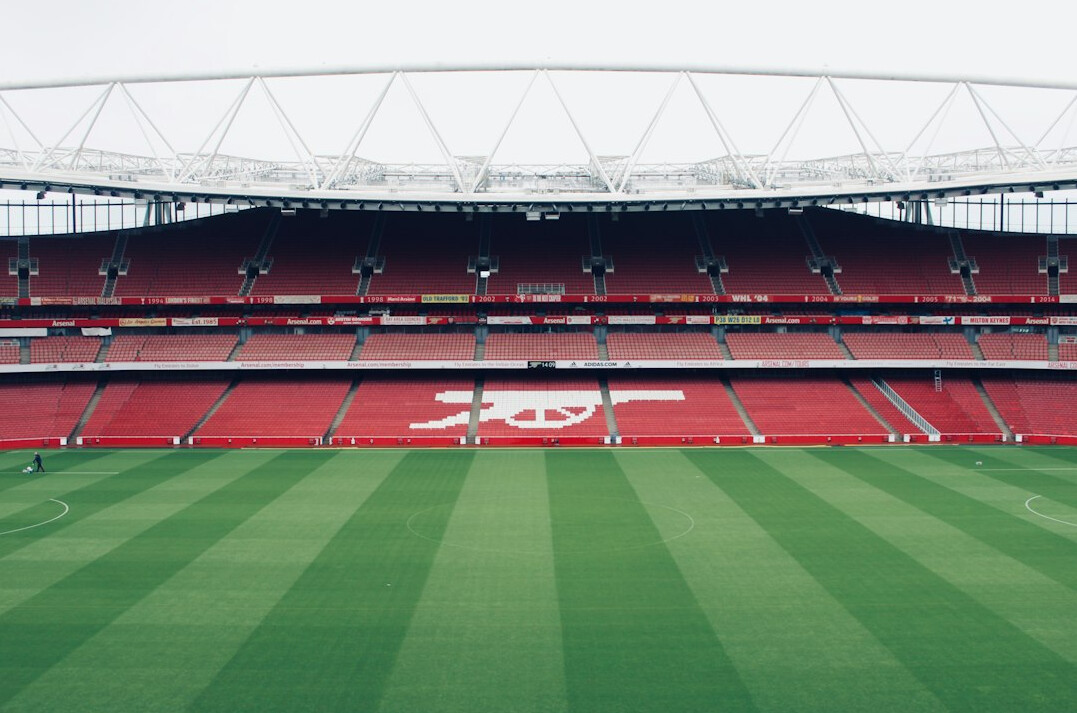 Empty football stadium seating and pitch